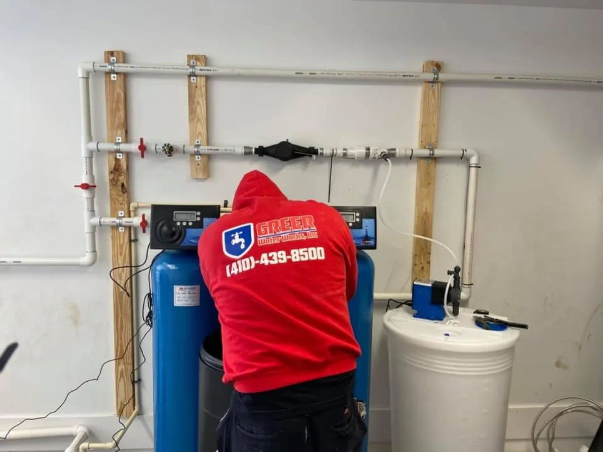 Greer Water Works technician servicing a high-demand water heater